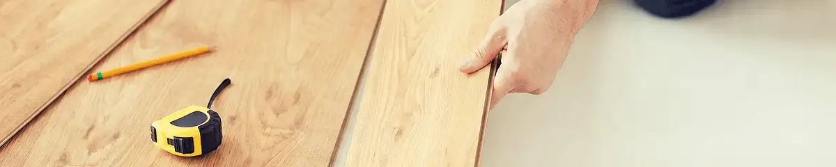 A professional installing wood flooring in Little Rock, AR