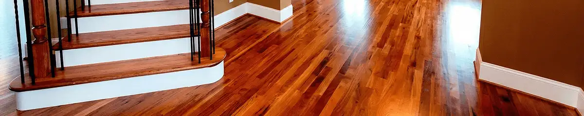 Base floor of a staircase with professionally restored wood flooring in Little Rock AR