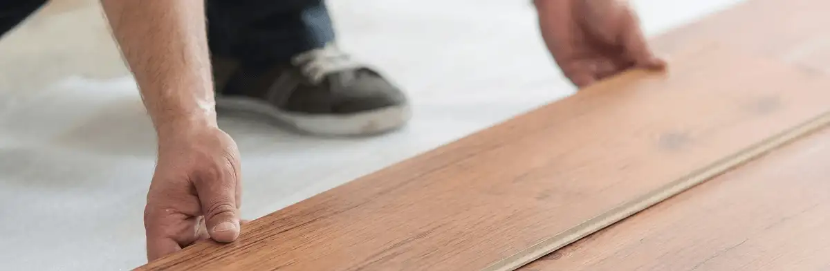 A professional installing laminate flooring in Little Rock, AR