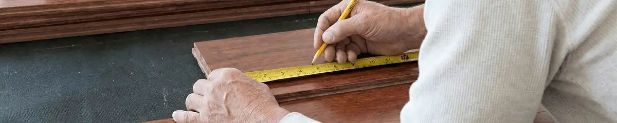 A professional installing wood flooring in Little Rock, AR